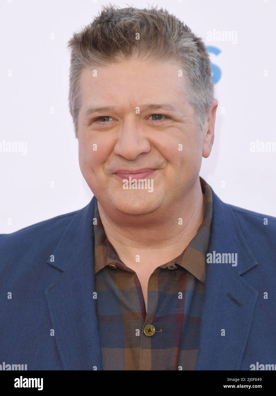 Lance Barber arrives at the Premiere Of Warner Bros. 100th Episode Of