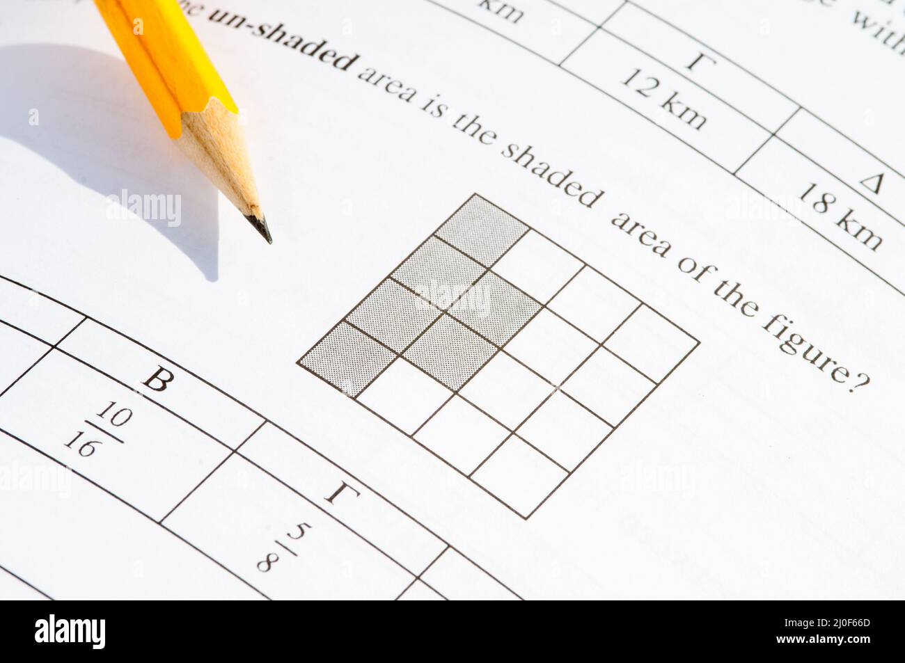 Mathematics problem solving with exam paper questions. Stock Photo