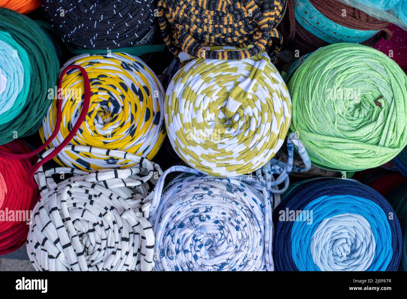 Rolled Stylish comfort and colourful blankets stored on top of each other. Stock Photo