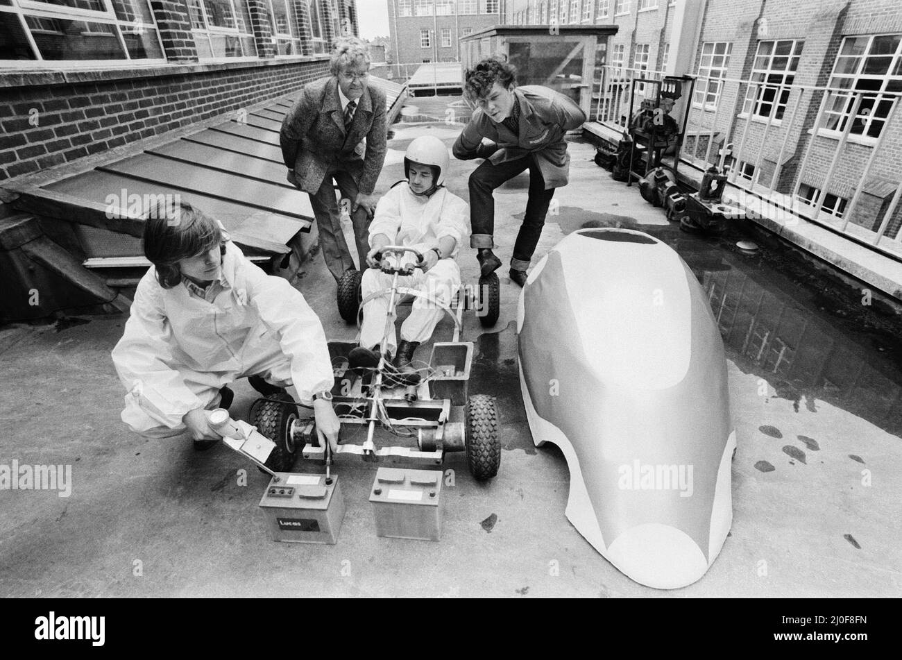 Picture shows students and lecturer at Garretts Green Technical College in Birmingham pictured with their electric electronic car.  At work on the car Daryl Boardman (18) in foreground checks cars batteries, with Michael Parry (18) in drivers seat, also in the picture are Mr. John West, lecturer at the collage on the Motor Vehicle Body Courses and 18 year old Paul Radcliffe.  Photo taken 15th August 1979. Stock Photo
