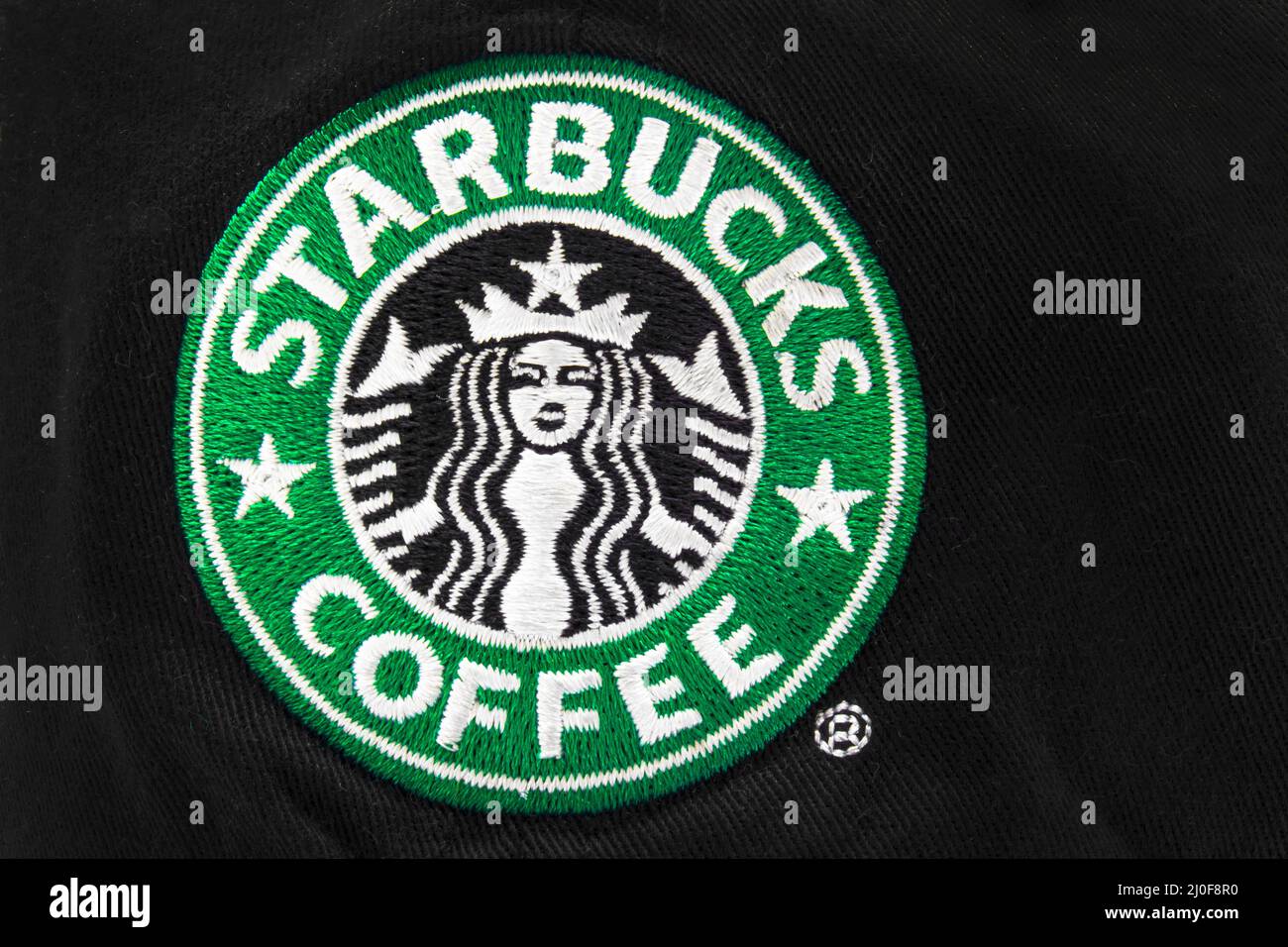 Calgary, Alberta, Canada. Aug 2, 2020. Close up of a Starbucks Coffee logo on a black cap or hat. Stock Photo