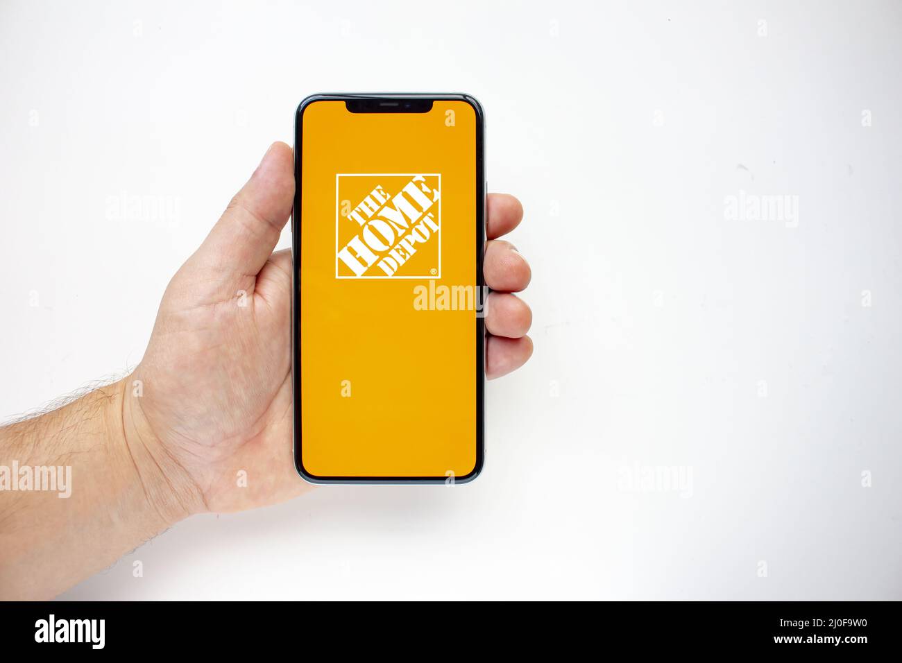 Calgary, Alberta, Canada. Aug 15, 2020. A person holding an iPhone 11 Pro Max with the Home Depot App Stock Photo
