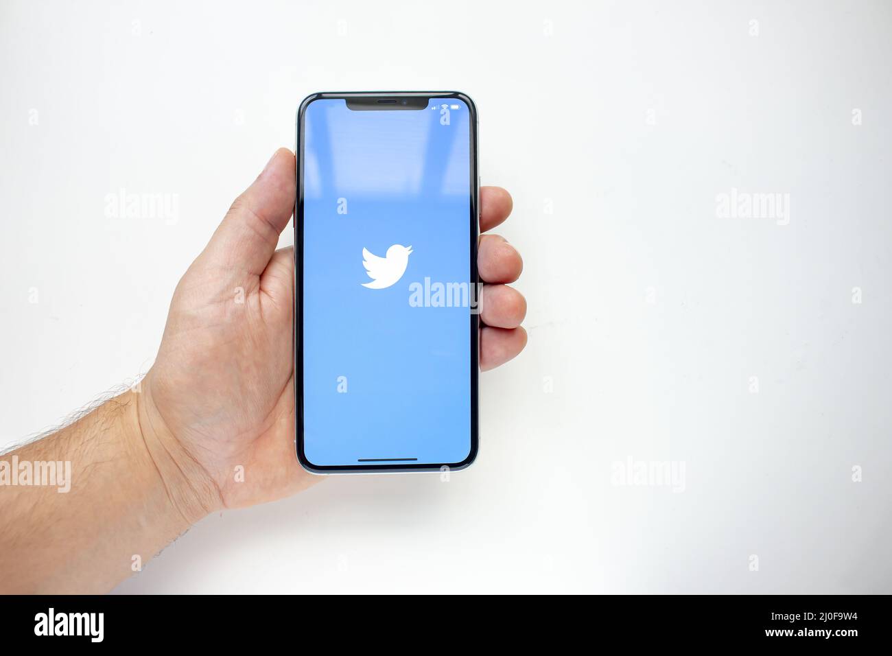 Calgary, Alberta, Canada. Aug 15, 2020. A person holding an iPhone 11 Pro Max with the Twitter App Stock Photo