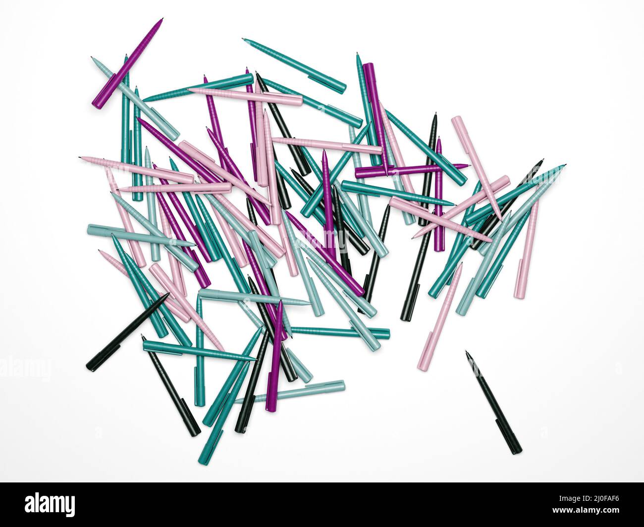 Multicolored plastic ballpoint pens are randomly scattered on a white background. 3D rendering Stock Photo