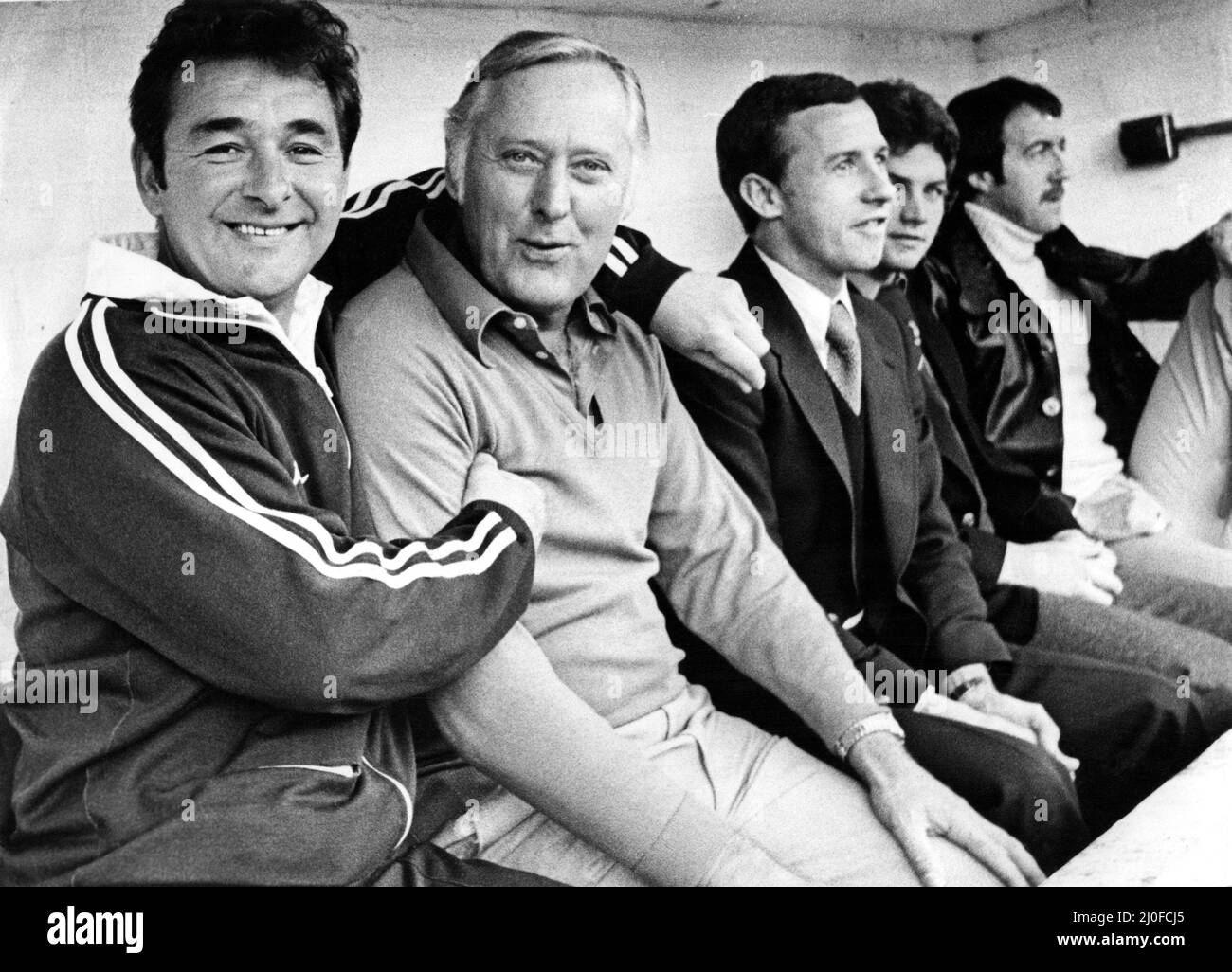 Nottingham Forest manager Brian clough hugs assistance manager Peter Taylor with Frank Clark seated at the far right of the dug-out 3 March 1979 Stock Photo