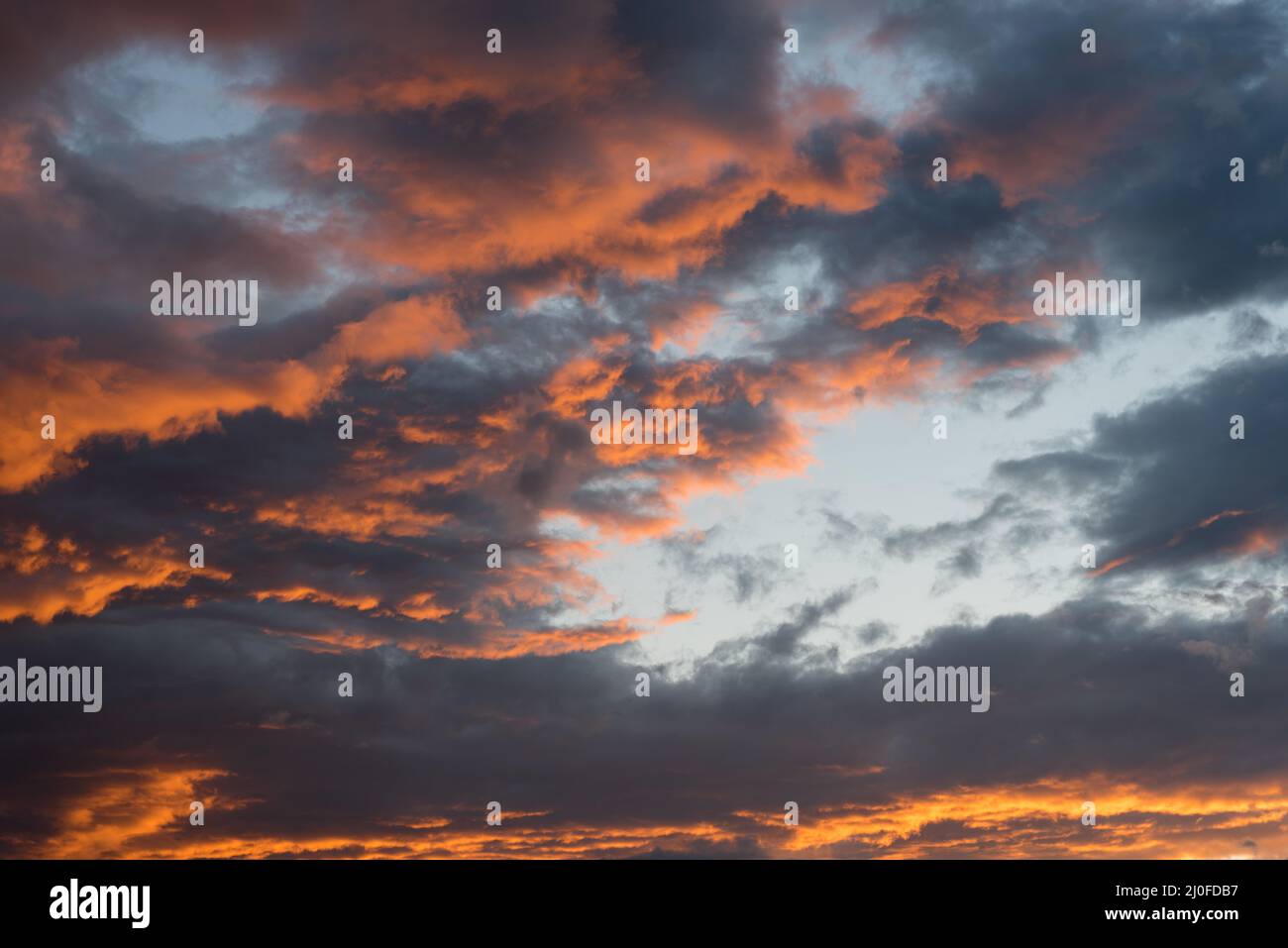 Dramatic sunset sky with orange cloud colors Stock Photo
