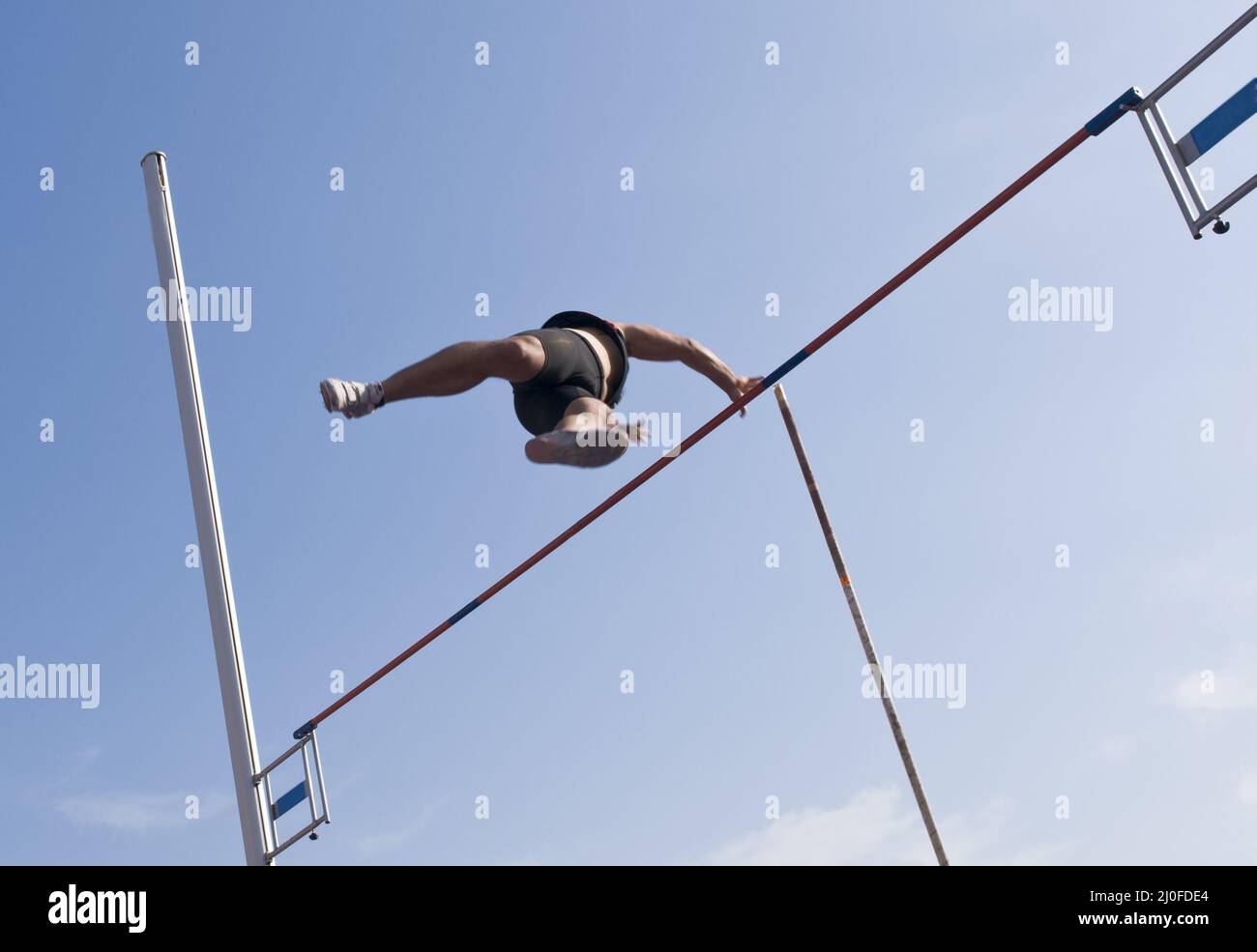 Male athlete jumping at pole vault Stock Photo Alamy