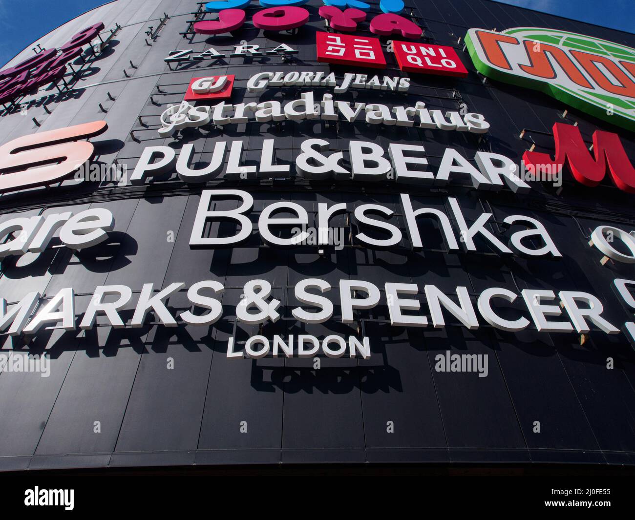 Moscow, Russia. 17th Mar, 2022. Brand names such as Marks & Spencer, Bershka,  Zara, Oysho, Stradivarius, Pull&Bear, Gloria Jeans seen on the façade of a  large shopping center "Salarievo" in the west