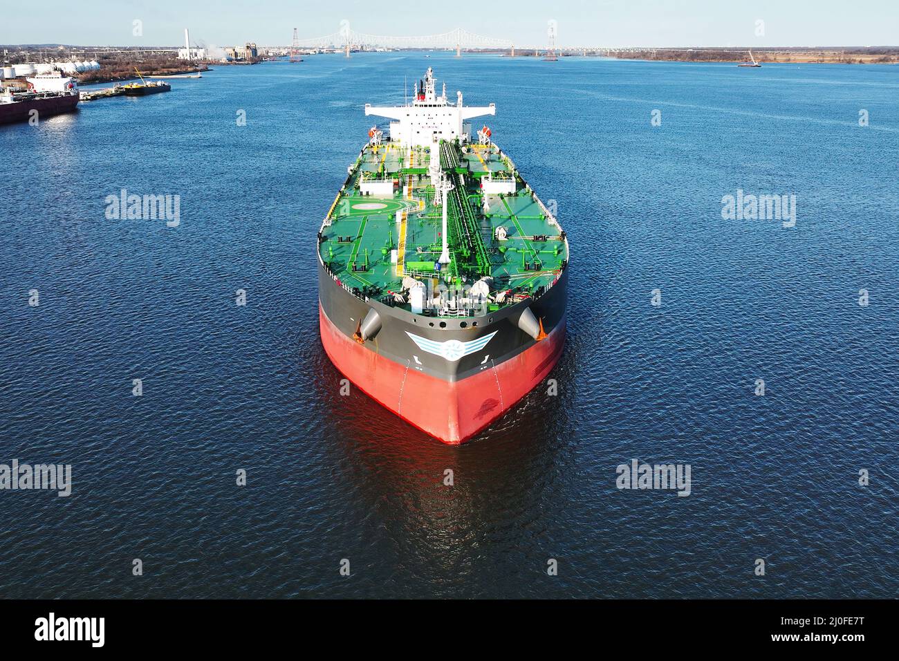 Aerial Drone View of Crude Oil Tanker Leaving Port Aerial Drone View of Crude Oil Tanker Leaving Port Stock Photo