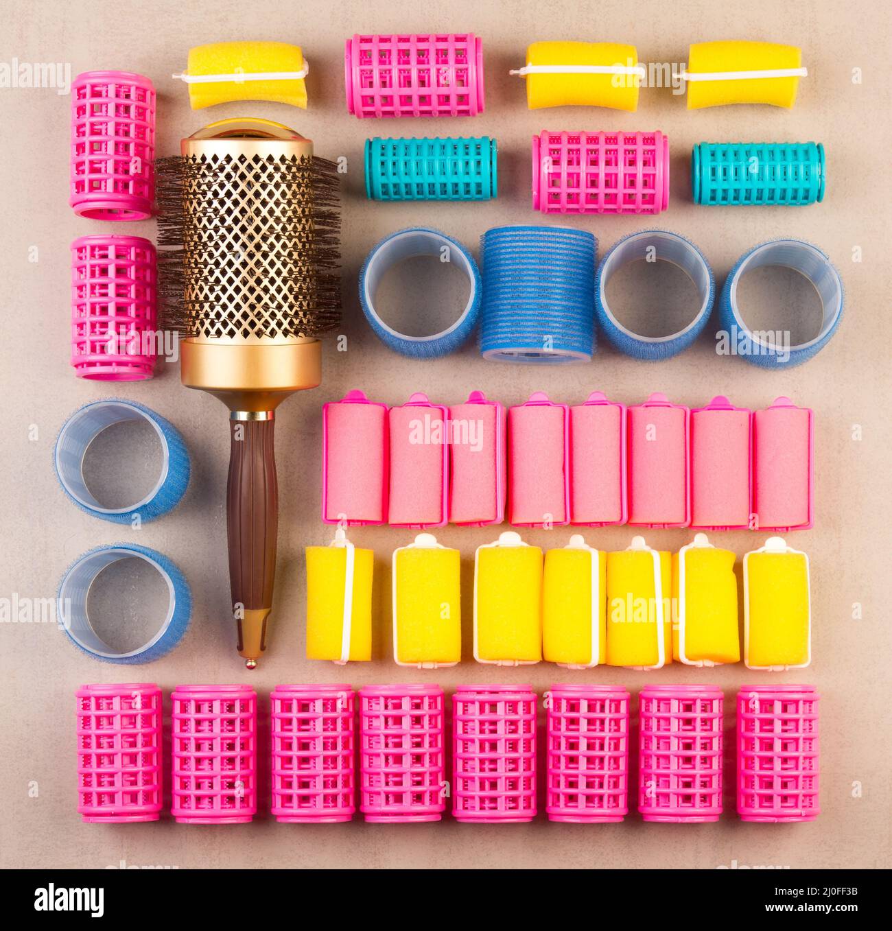 Curlers for hair of different colors and comb top view close-up Stock Photo