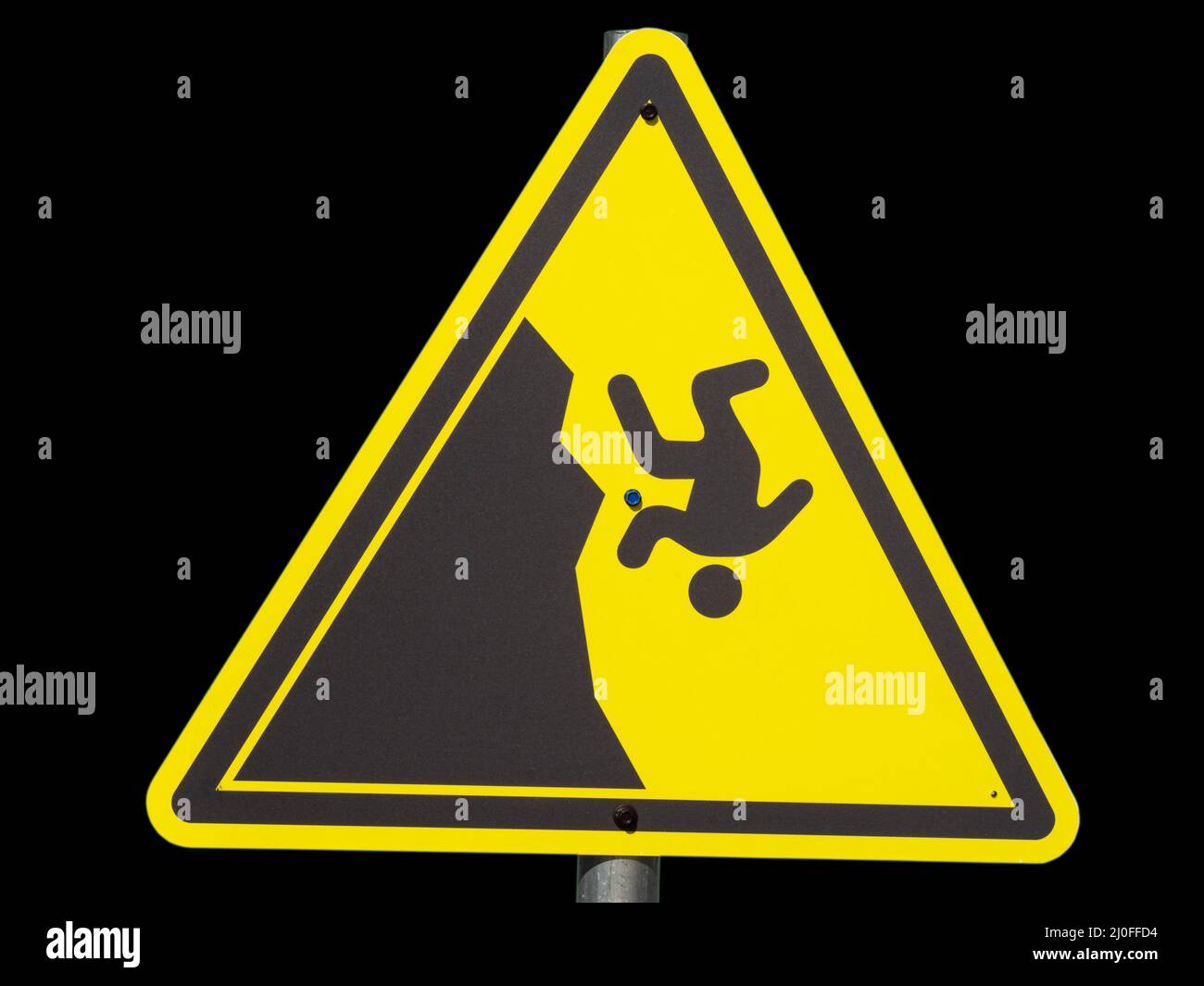 Yellow triangular sign with a man falling from a cliff on a black background Stock Photo