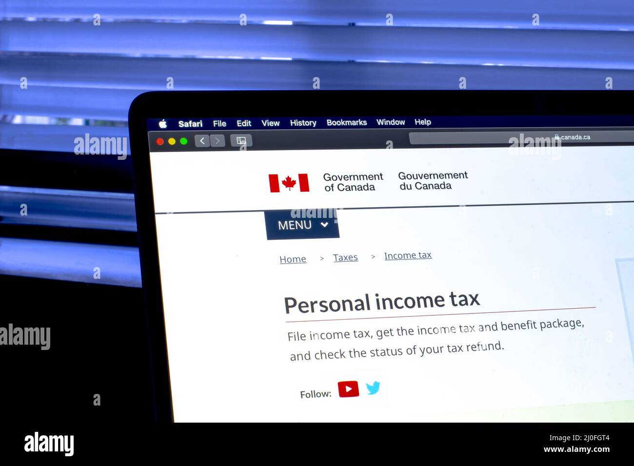 Calgary, Alberta, Canada. Oct 7, 2020. A laptop with the Goverment of Canada tax revenue website on the screen. Stock Photo