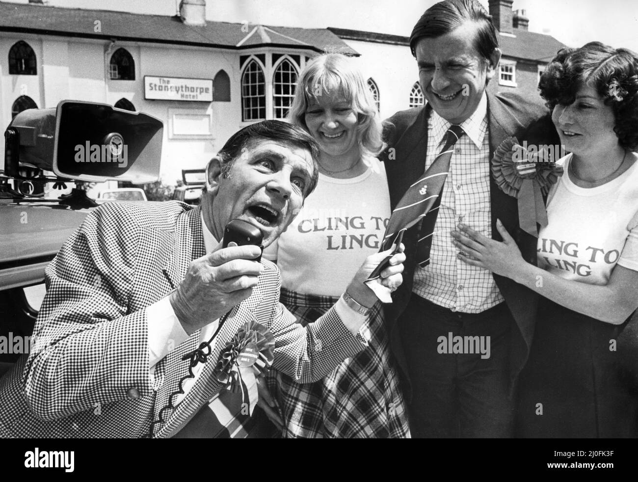 Comedian Norman Wisdom repays a favour by canvassing for Midlands Central Tory candidate Mr. John Ling.  Some years ago Mr. Ling, a former diplomat, organised a concert in Chile for the diminutive comic, who is currently appearing at the Coventry Theatre.  Joining in the act are Southam barmaids Pauline Haughton(left) and Margaret Burgess.5th June 1979 Stock Photo