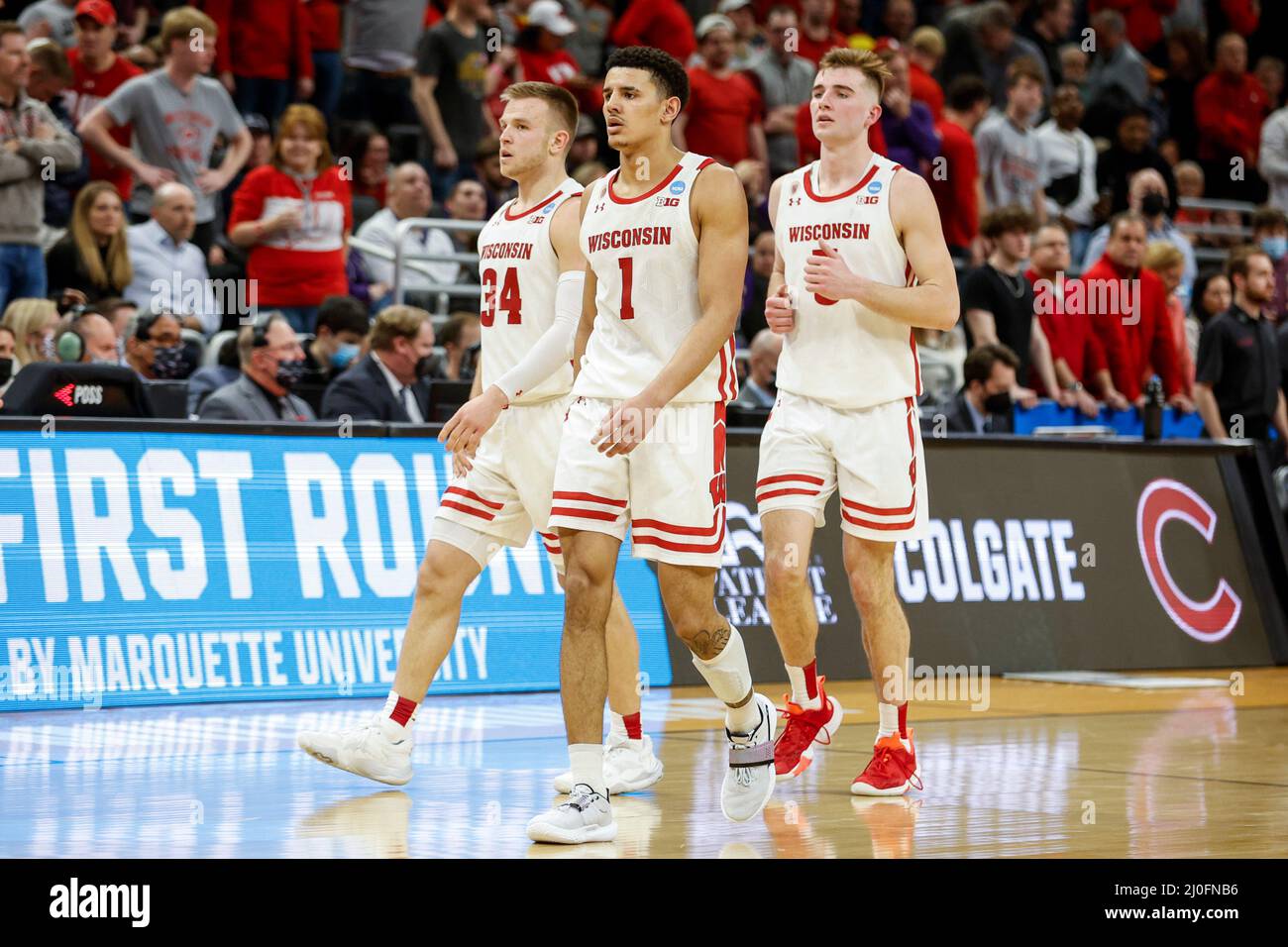 Milwaukee, WI, USA. 18th Mar, 2022. Wisconsin Badgers guard Johnny Davis (1), guard Brad Davison (34), and forward Tyler Wahl (5) during the NCAA Men's March Madness Tournament basketball game between the Colgate Raiders and the Wisconsin Badgers at the Fiserv Forum in Milwaukee, WI. Darren Lee/CSM/Alamy Live News Stock Photo