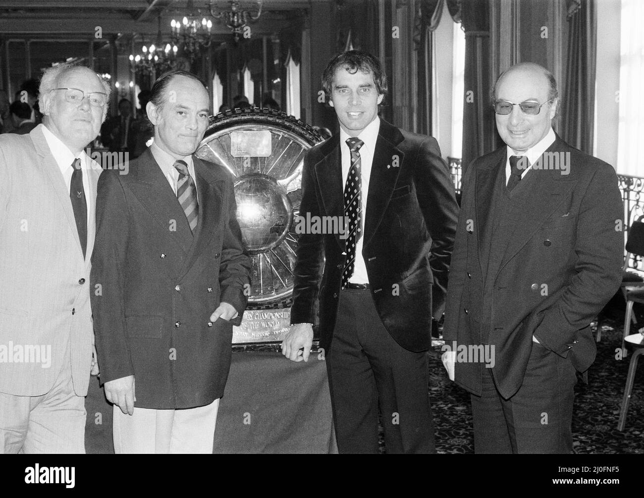 Ivan Mauger MBE, Speedway Five Times World Champion, is presented with the Sunday Mirror Winged Wheel Trophy, by Tony Smith, 2nd left, Sports Editor of the Sunday Mirror, 11th April 1978. Stock Photo