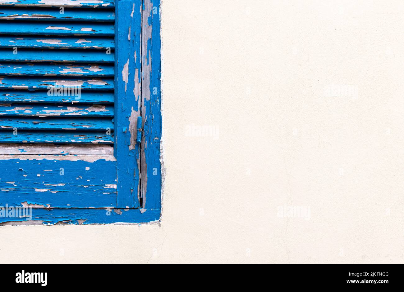 Blue window on a white wall Stock Photo