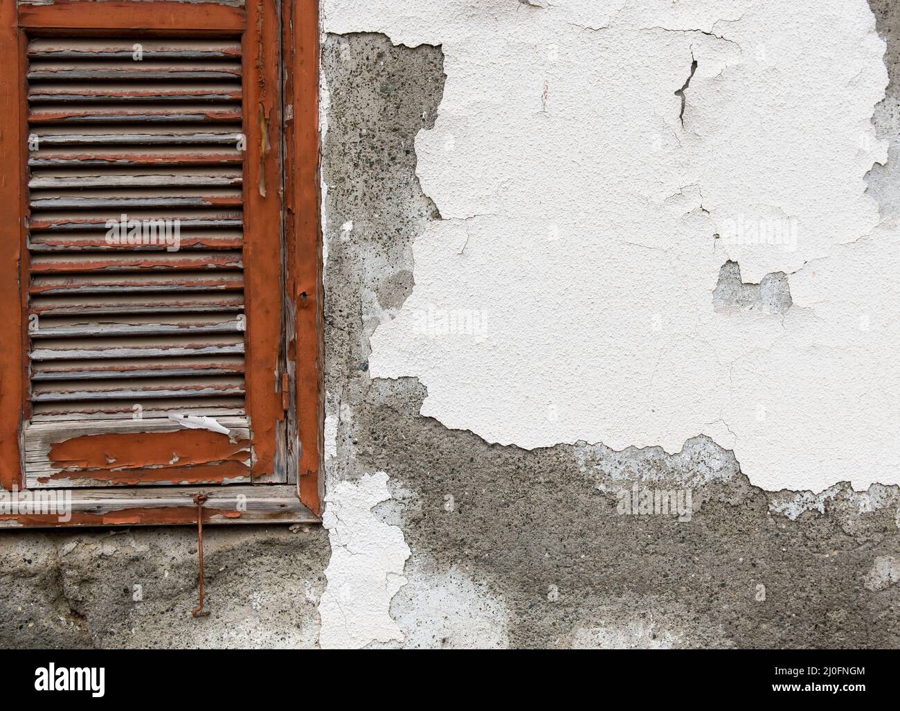 Red window on a white wall Stock Photo
