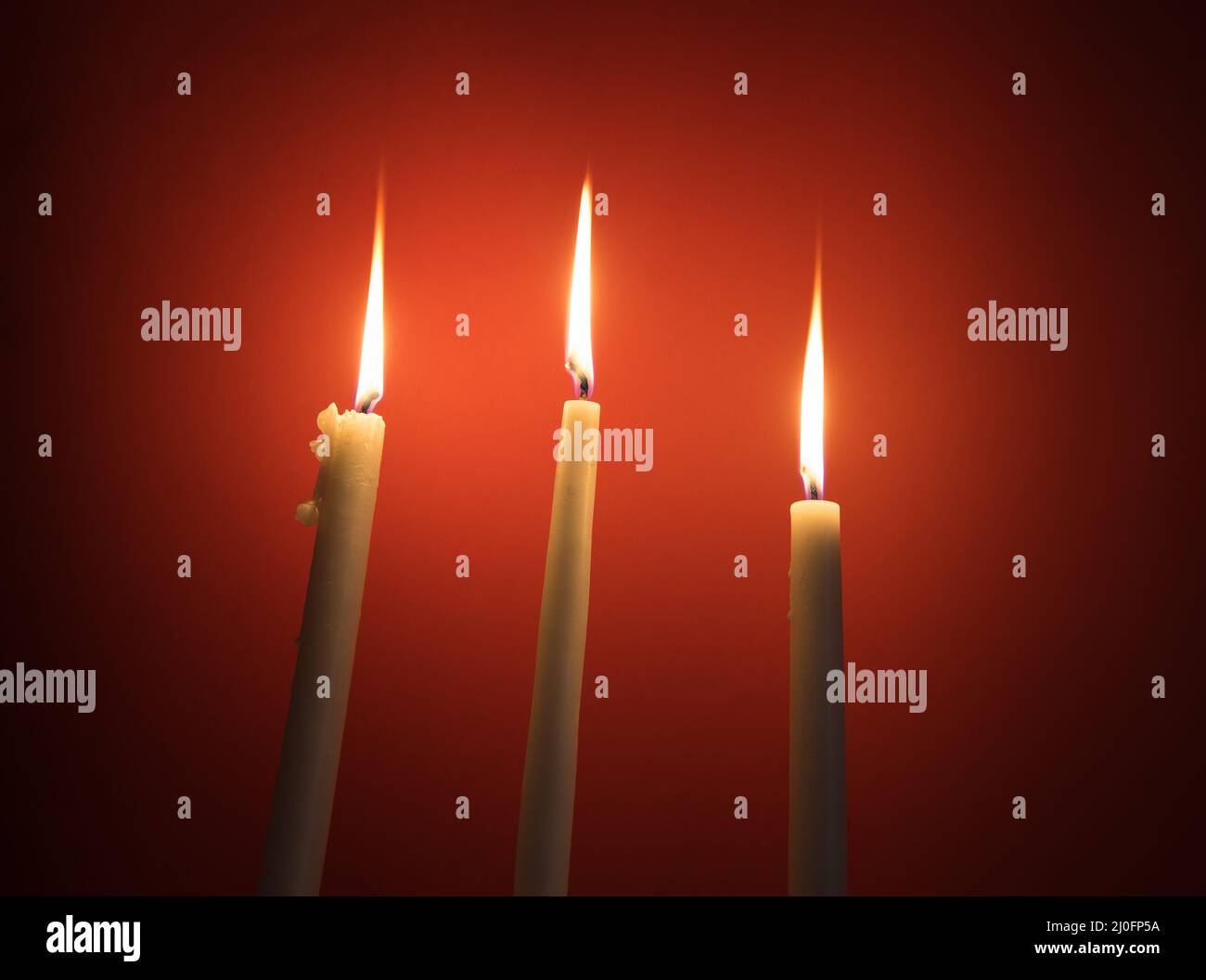Holy religious candles burning Stock Photo Alamy