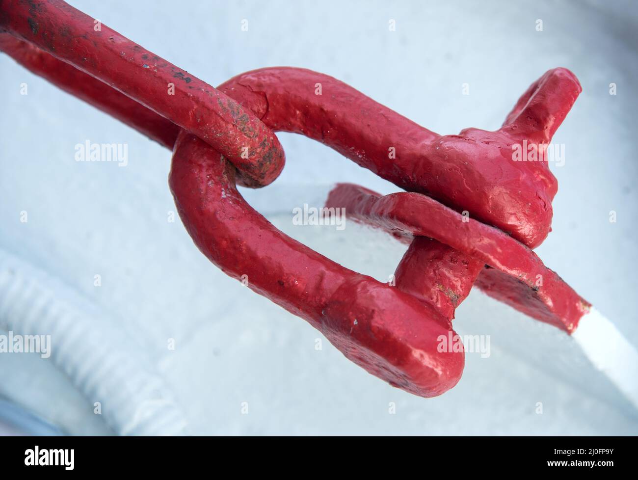 Red heavy industrial anchor shackle Stock Photo