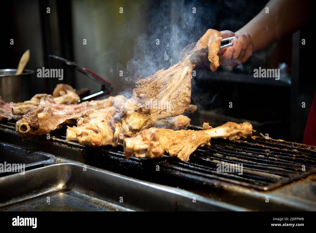 Chef Cooking traditional Chinese food on snack street in Beijing China Stock Photo