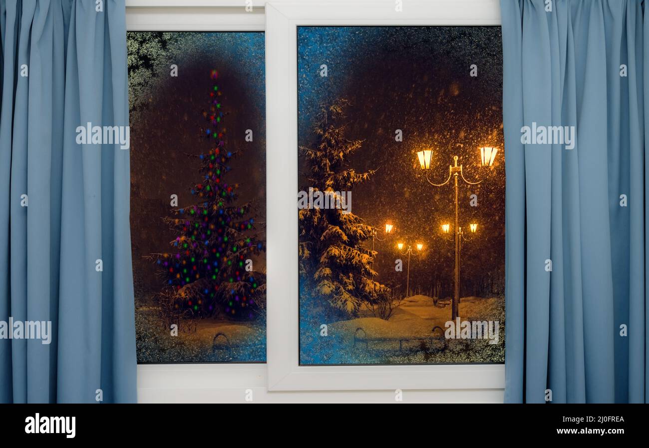 Frozen window view the night before christmas Stock Photo
