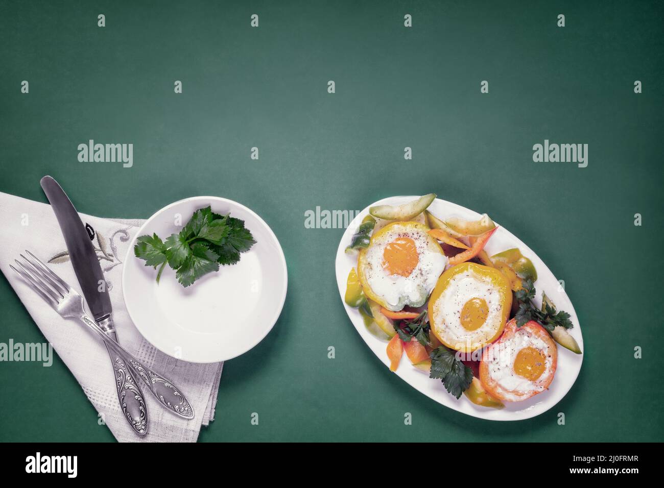 Baked bell pepper with egg inside the pepper Stock Photo Alamy