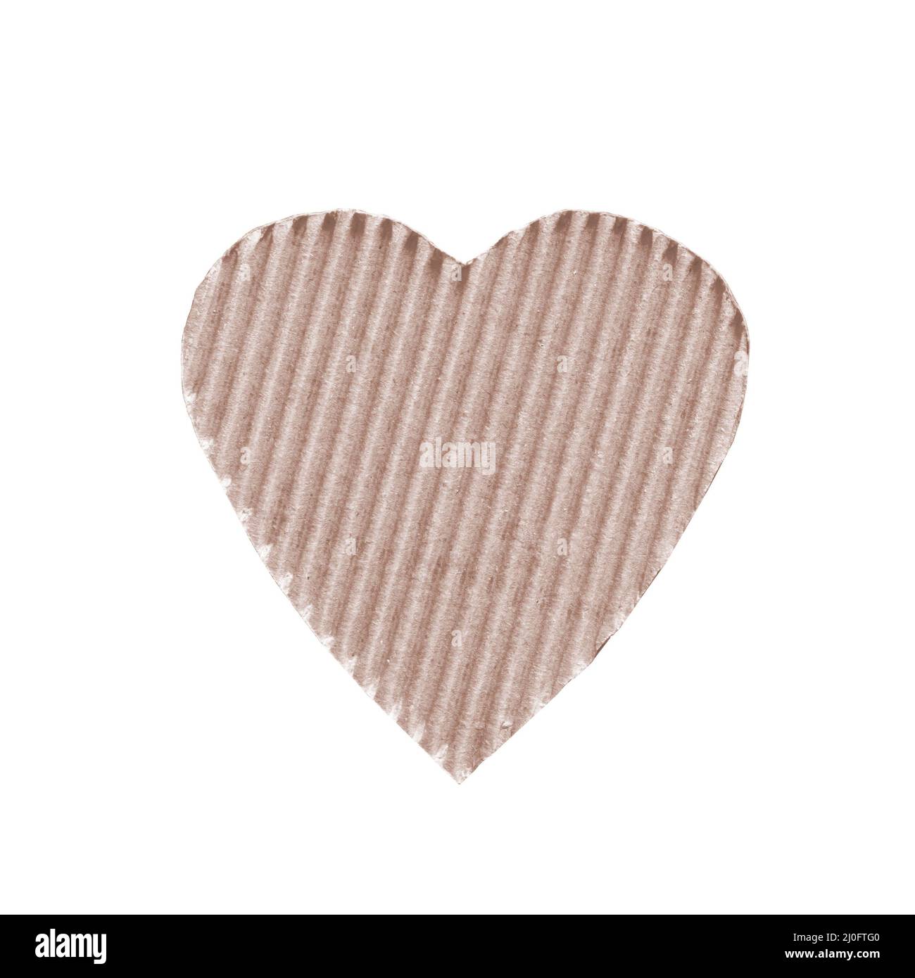 The symbol of a heart set sail champagne color cut from corrugated cardboard isolated on white backg Stock Photo