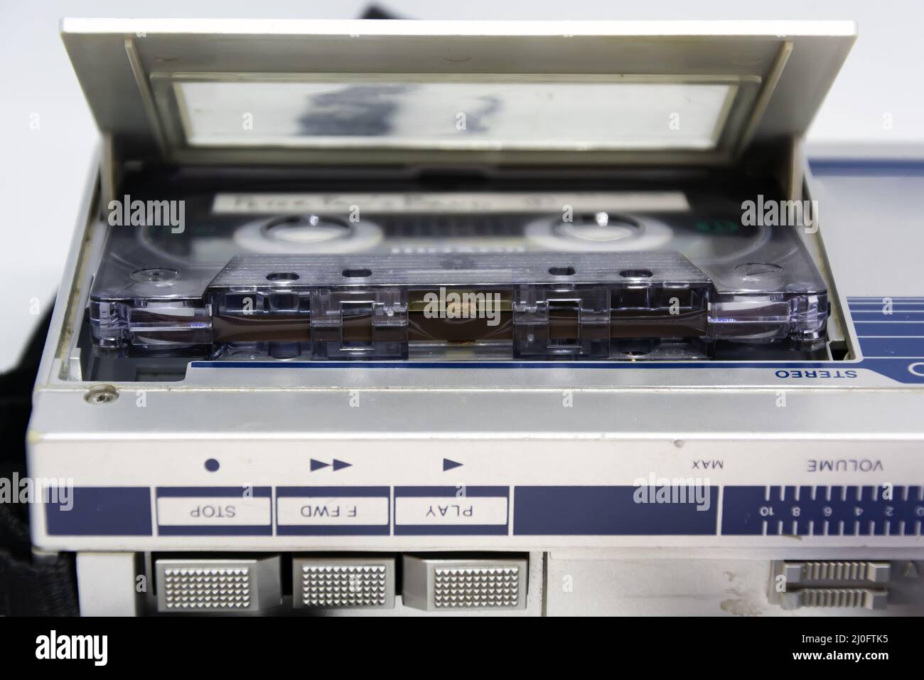 Detail of the head behind the magnetic tape of an old audio cassette inserted in a player Stock Photo