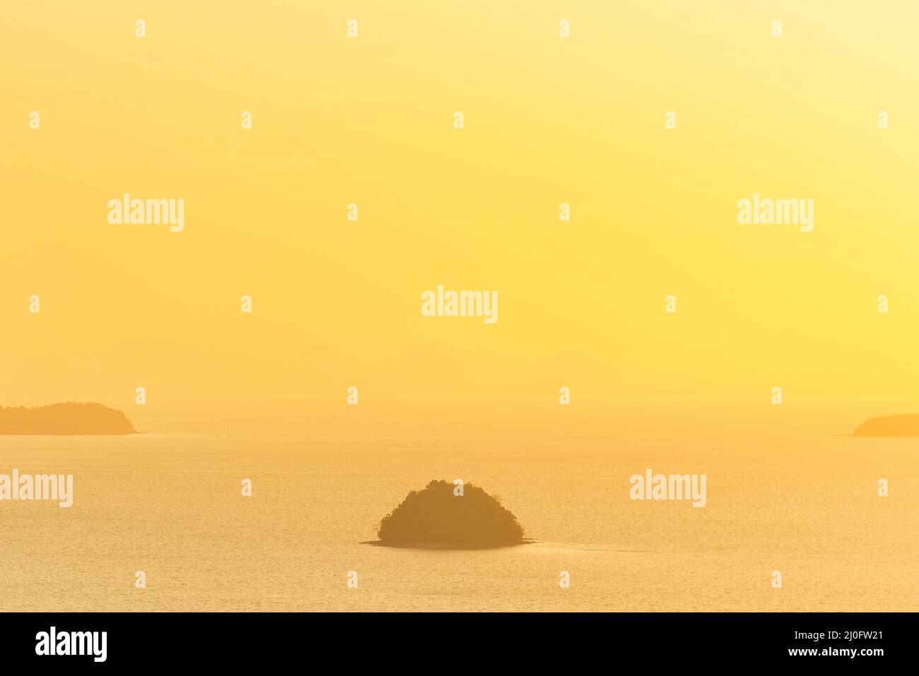 Many small islands on sunset sea Stock Photo Alamy