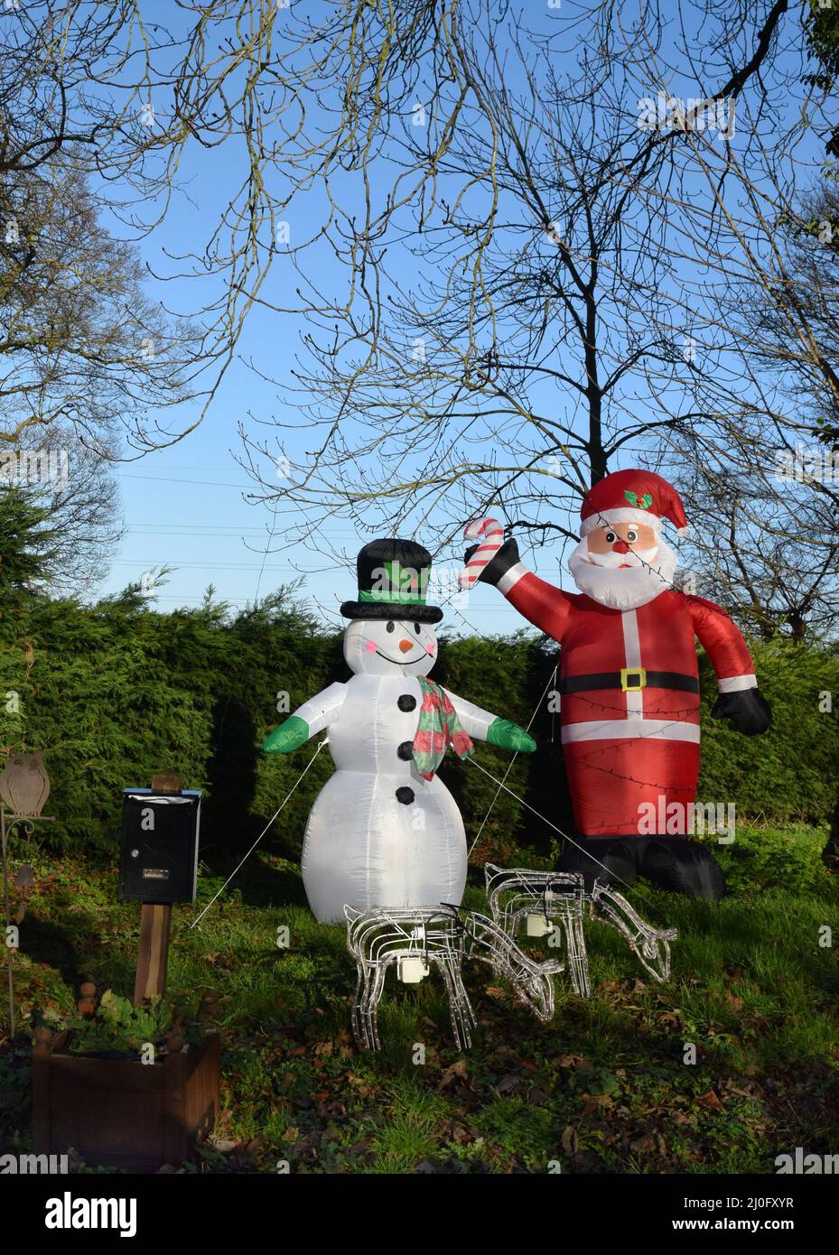 inflatable snowman and father christmas, england Stock Photo