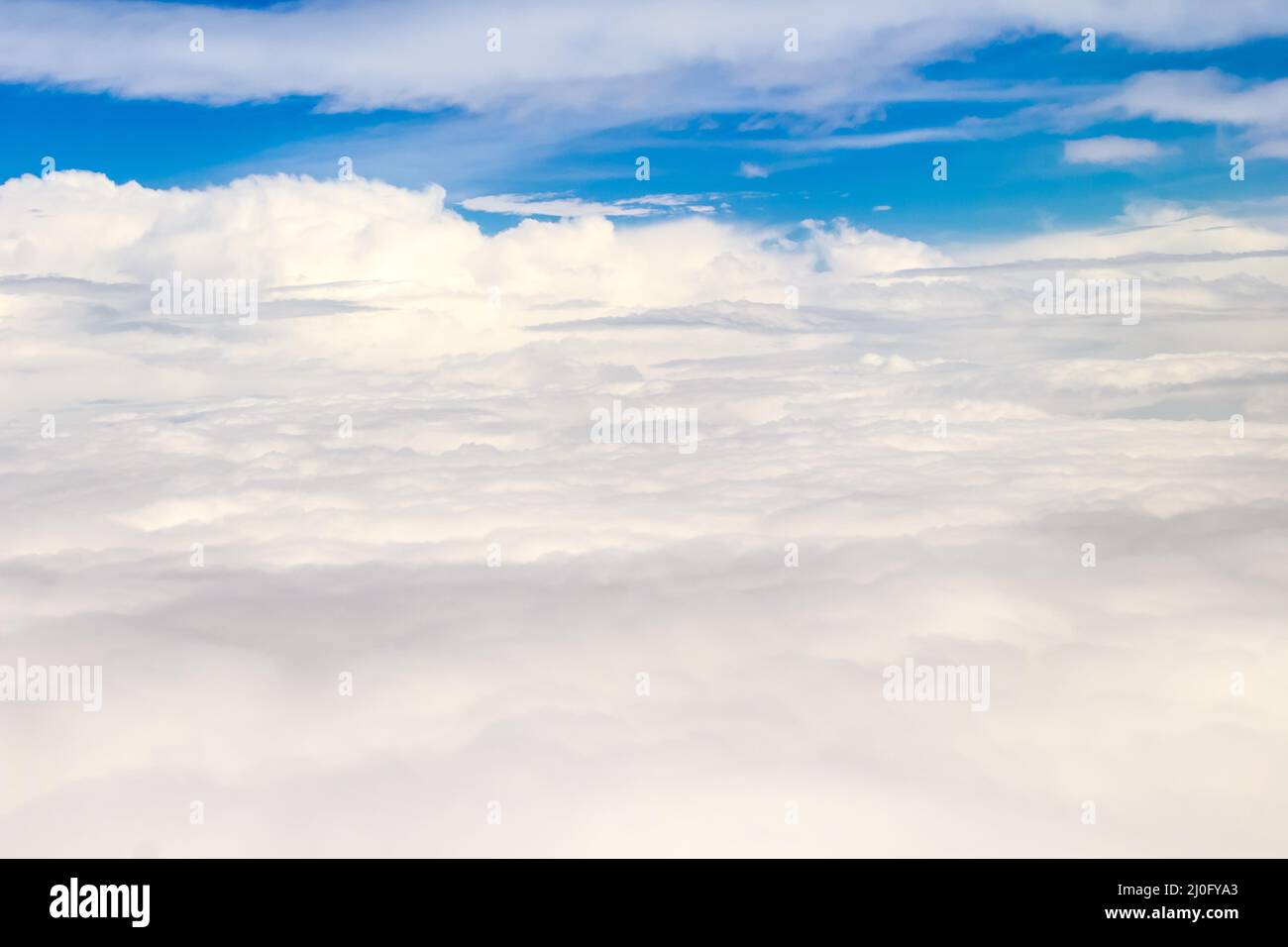 Beautiful cloudscape from sky aerial view. Beauty of nature view from above the sky and clouds. White clouds and blue sky view f Stock Photo