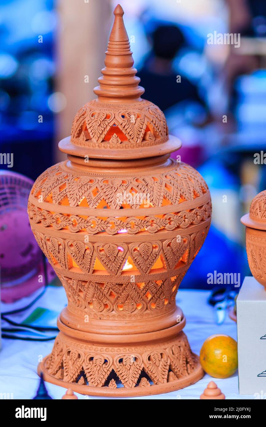 Beautiful handmade ceramic lamp in Thai's style patterns. Pottery Lamp with Thai style Stock Photo