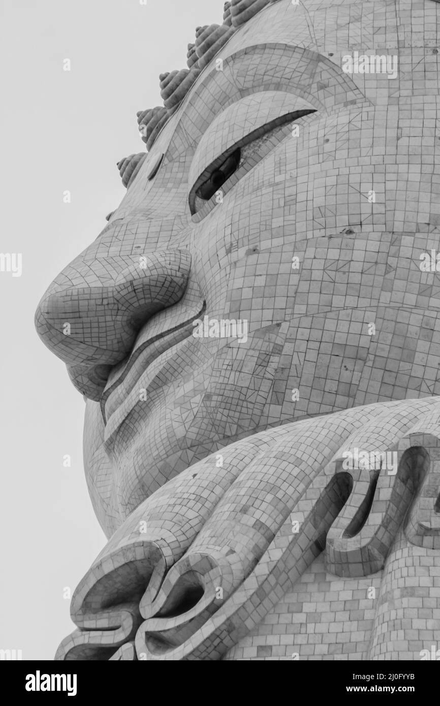 Amazing Massive white marble Buddha statue, the famous tourist attraction on top of hill in Phuket, Thailand. Stock Photo