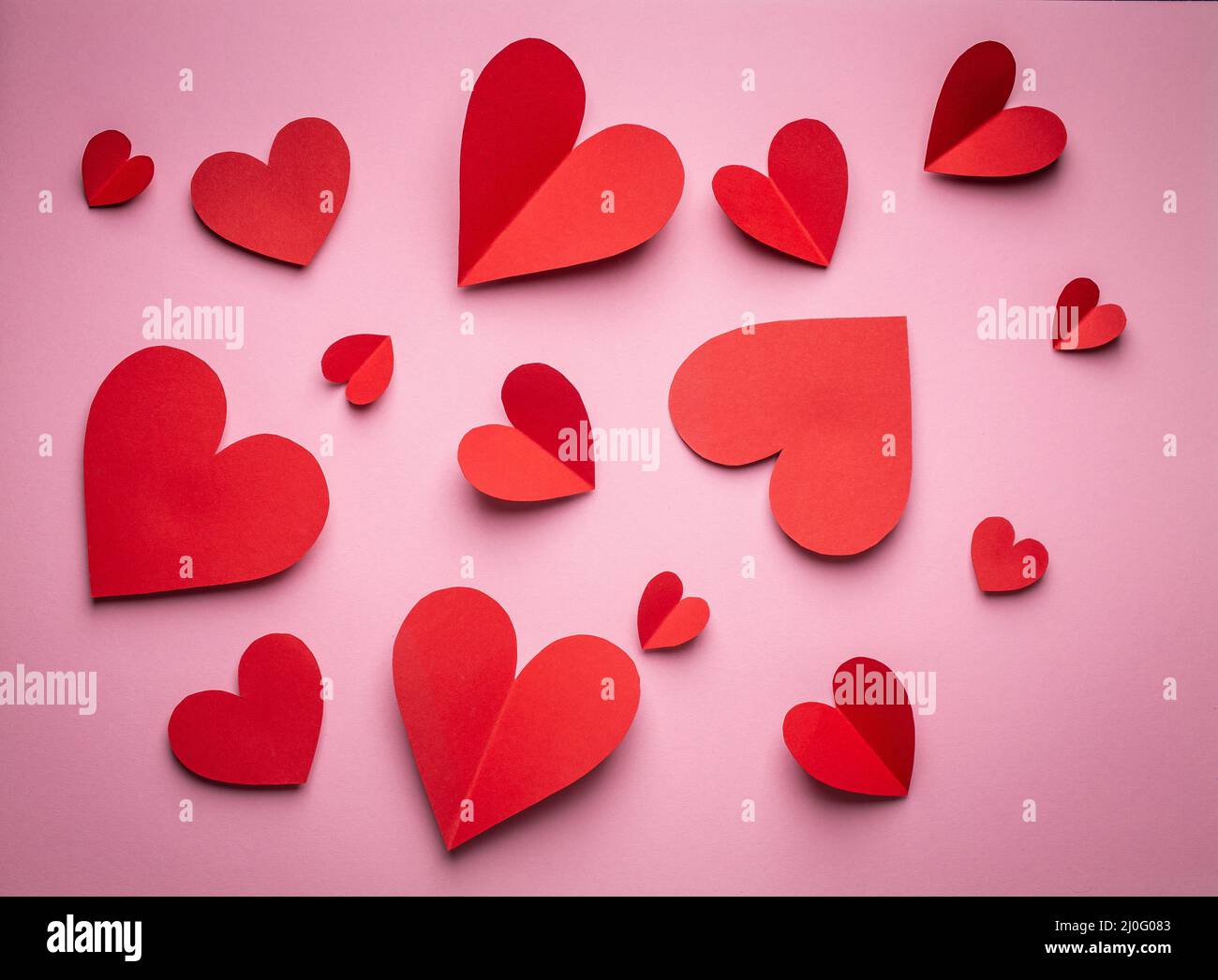 Valentine's day background with paper hearts Stock Photo