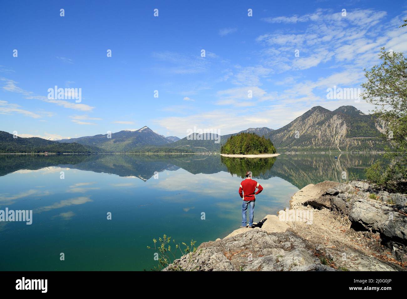 Man stands near the lake Stock Photo