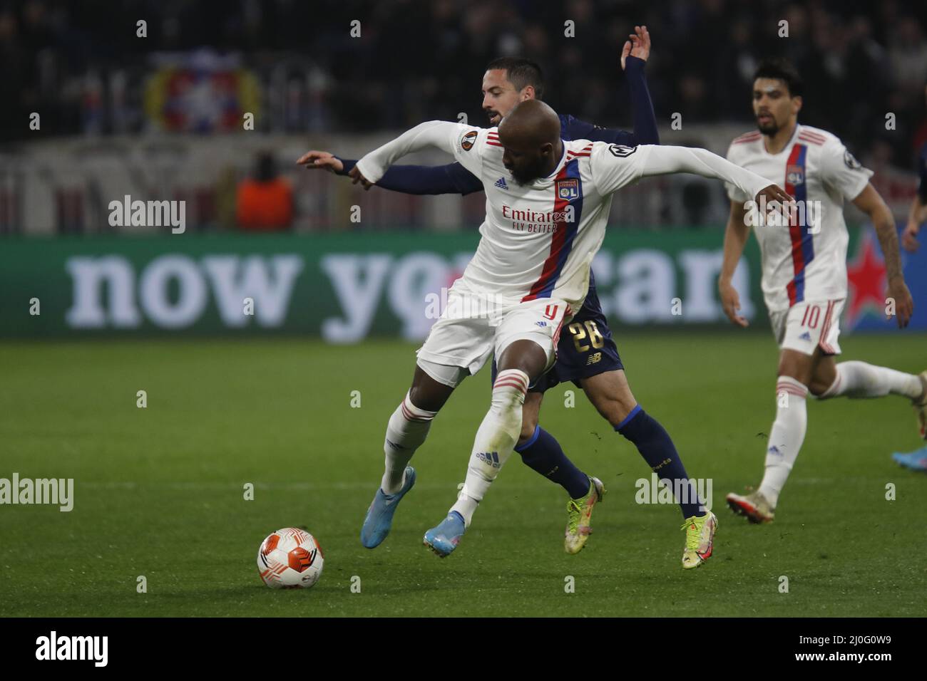 Moussa DEMBELE of Lyon and Bruno COSTA of Porto during the UEFA Europa League, Round of 16, 2nd leg football match between Olympique Lyonnais (Lyon) and FC Porto on March 17, 2022 at Groupama stadium in Decines-Charpieu near Lyon, France - Photo: Romain Biard/DPPI/LiveMedia Stock Photo