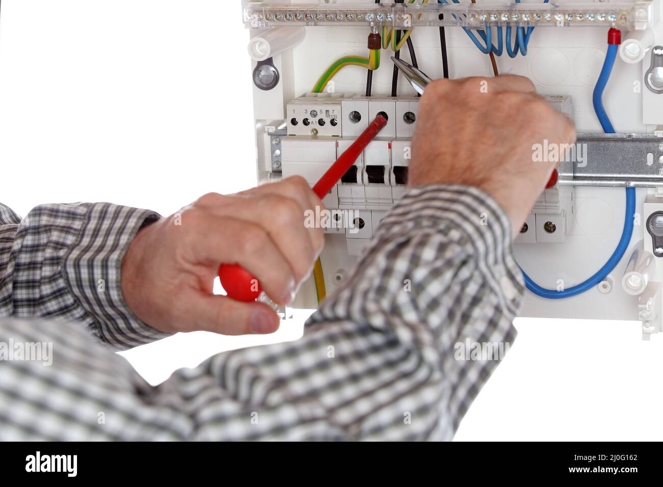 Working on electrical device Stock Photo