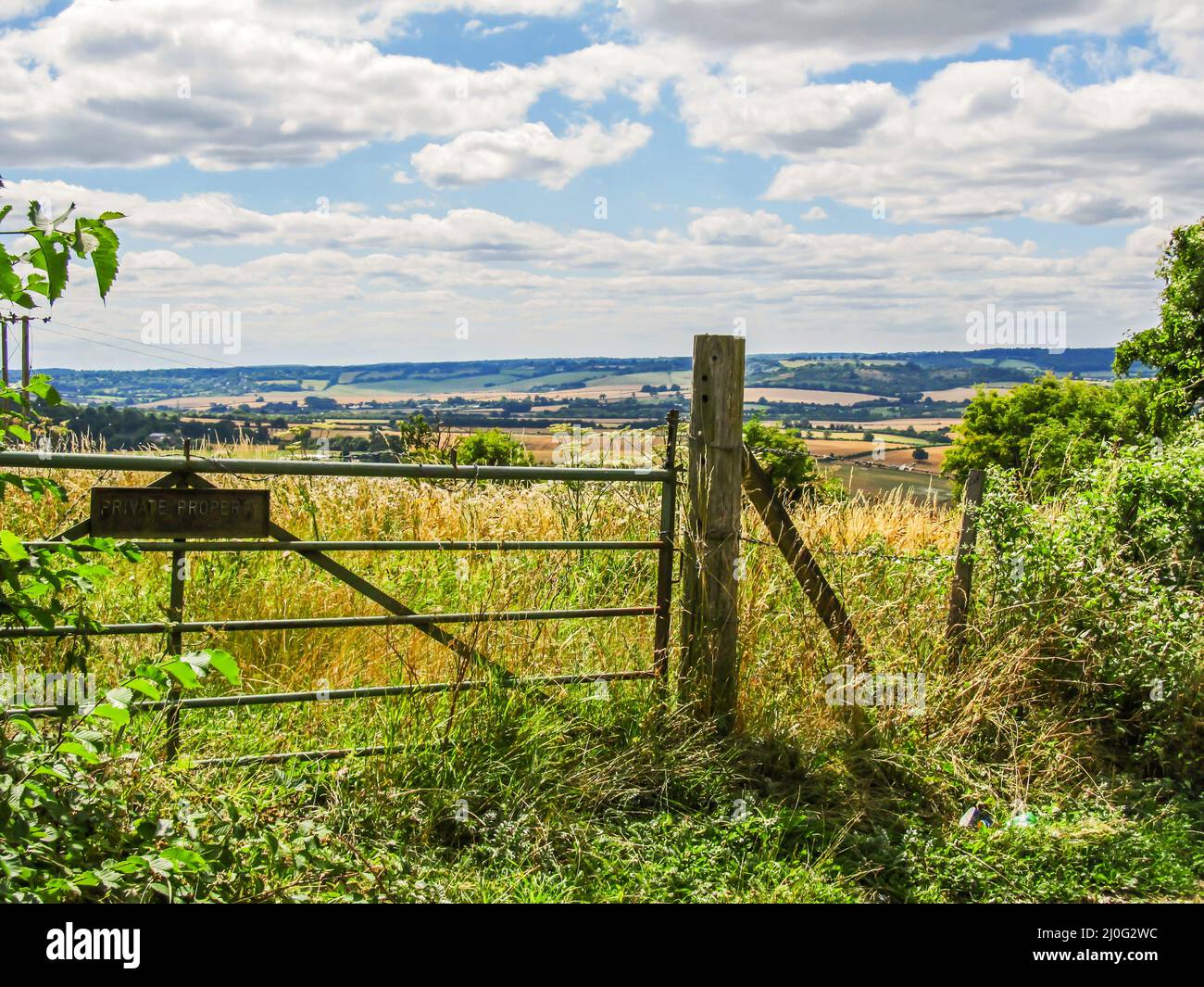 A gate leading to a wild grassland, part of the Whiteleaf nature