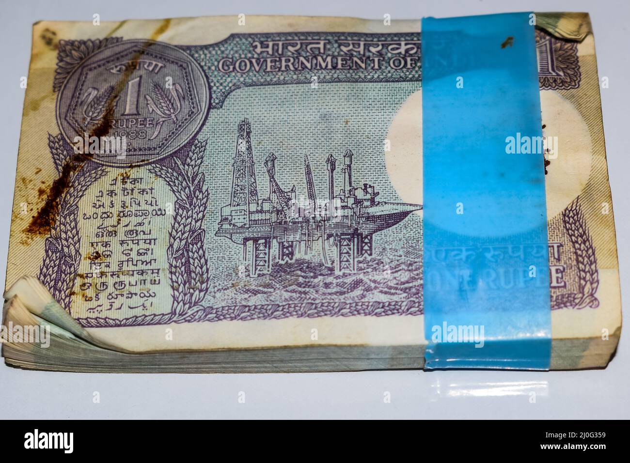 Old One Rupee notes combined on the table, India money on the rotating table. Old Indian Currency note on a rotating table, Indian Currency on the tab Stock Photo