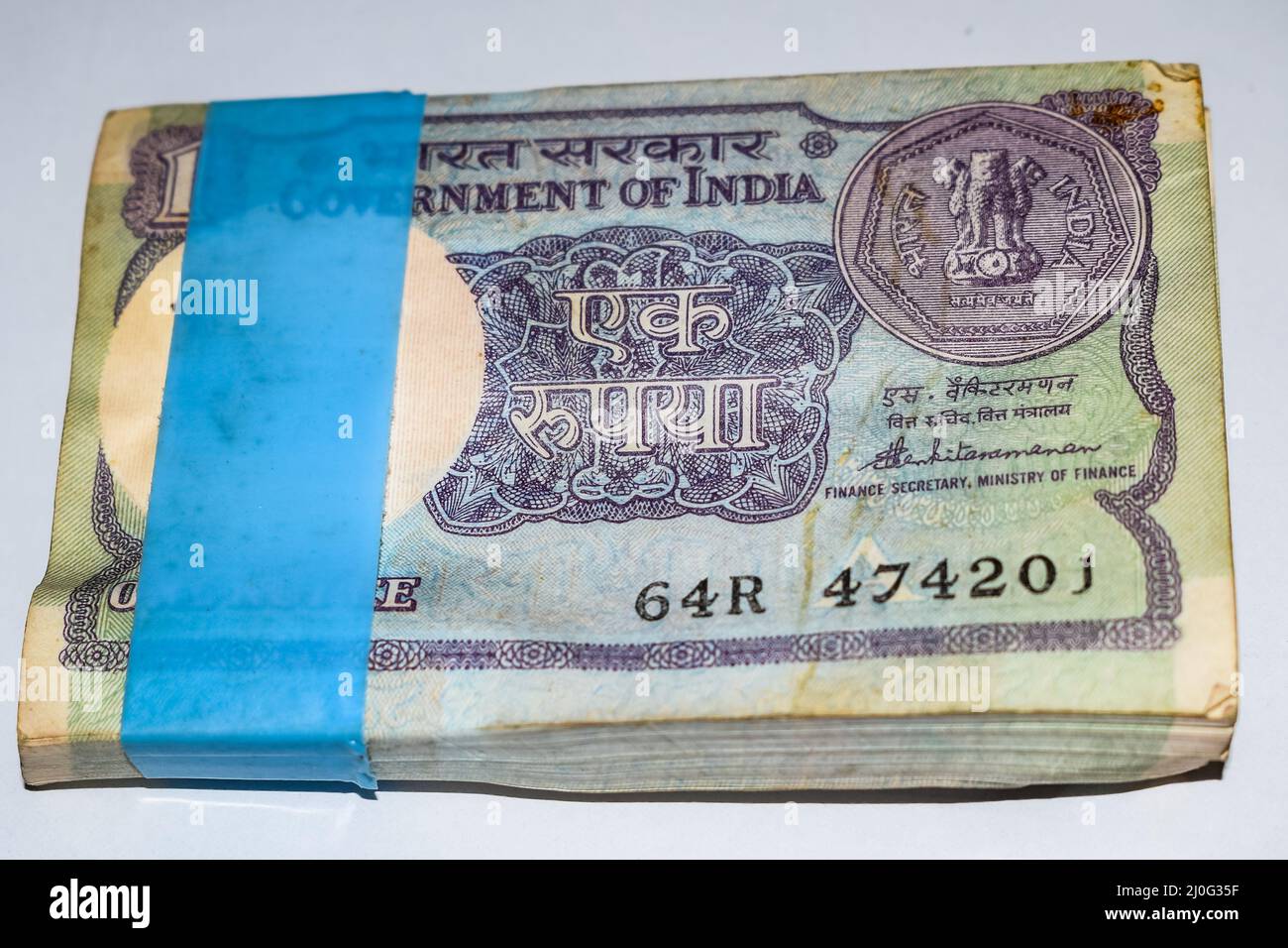 Old One Rupee notes combined on the table, India money on the rotating ...