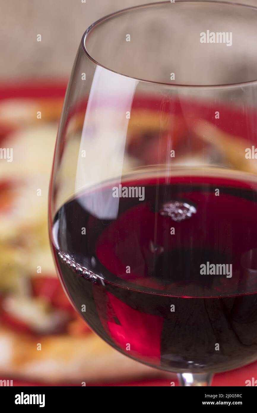 Full and half full red wine glass hi-res stock photography and images ...
