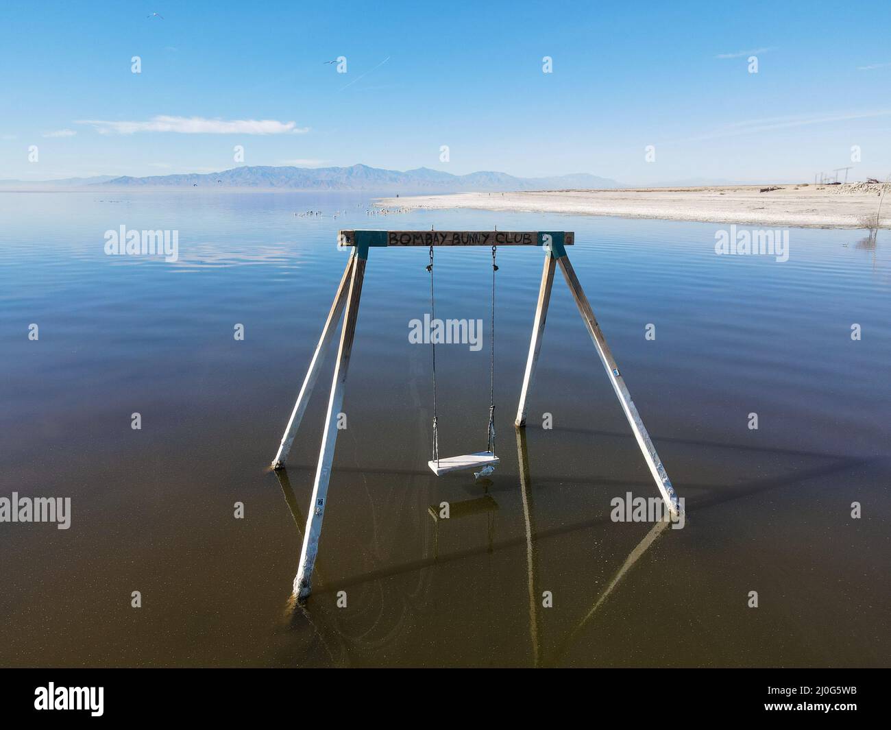 Abandoned swing in the water at Bombay beach, Salton Sea, California