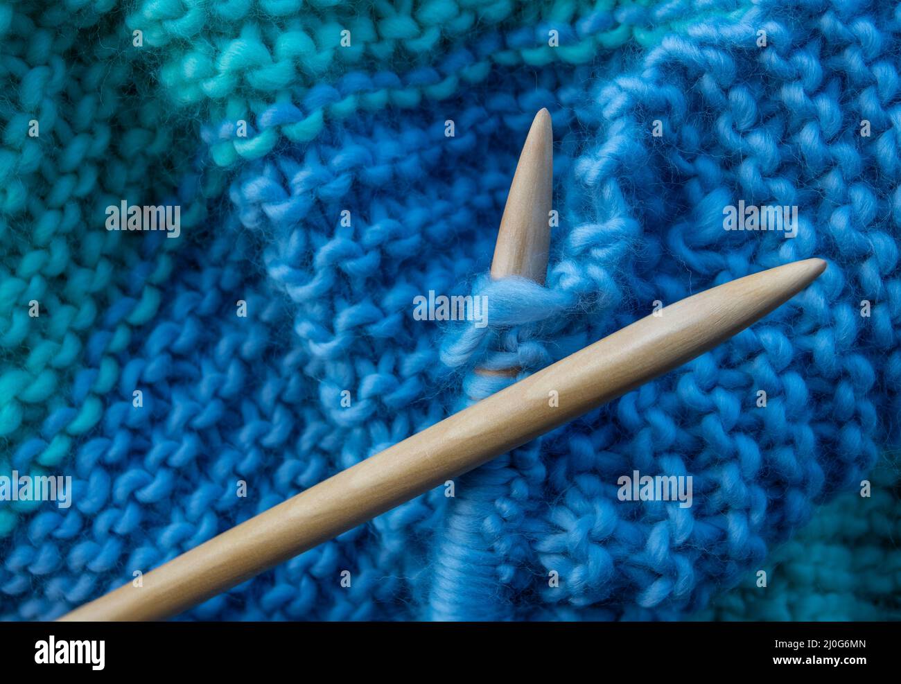 Wooden Knitting Needles And Yarn Stock Photo