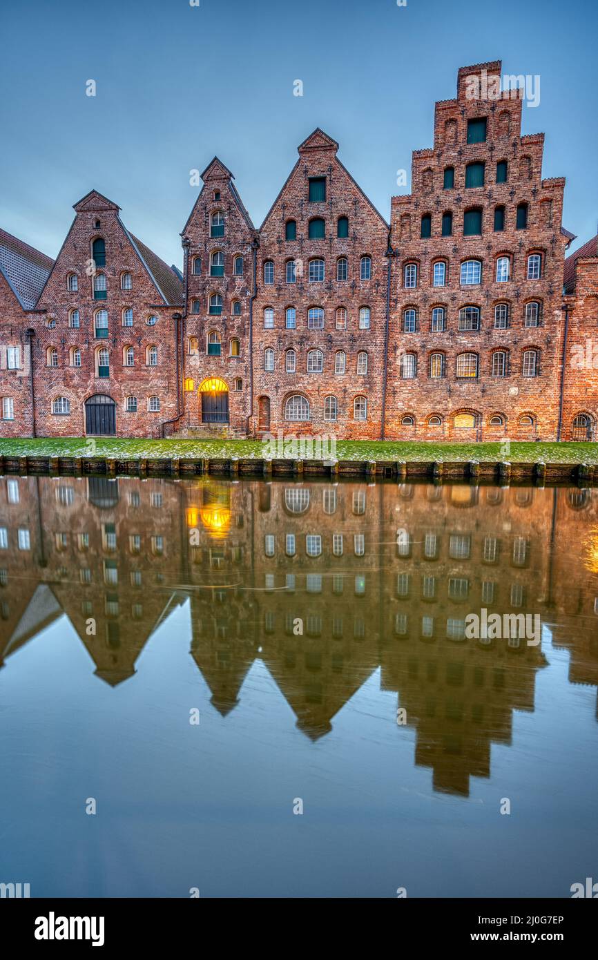 The medieval Salzspeicher with the Trave river at dawn, seen in Luebeck, Germany Stock Photo
