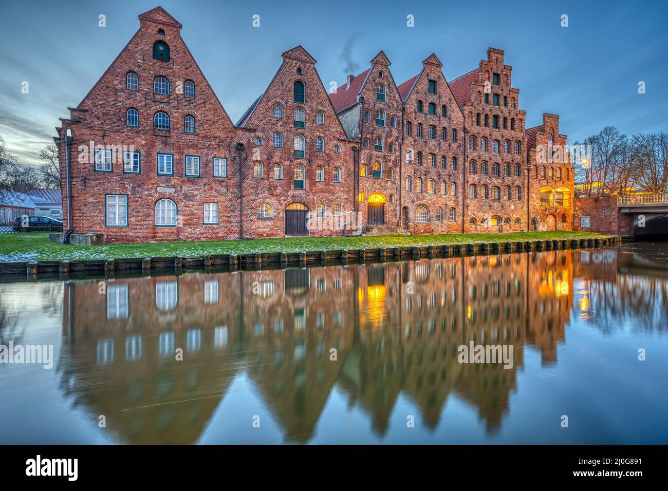 The historic Salzspeicher with the Trave river at dawn, seen in Luebeck, Germany Stock Photo