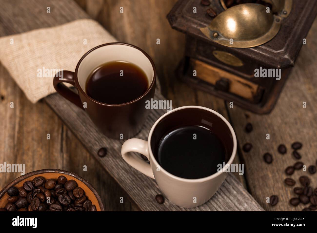Coffee and coffee beans on old rustic wood table Stock Photo - Alamy