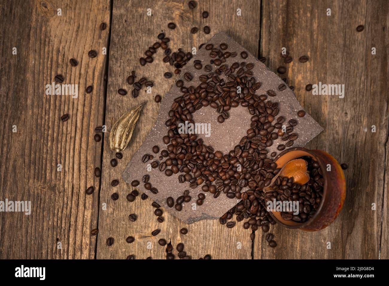Coffee and coffee beans on old rustic wood table Stock Photo