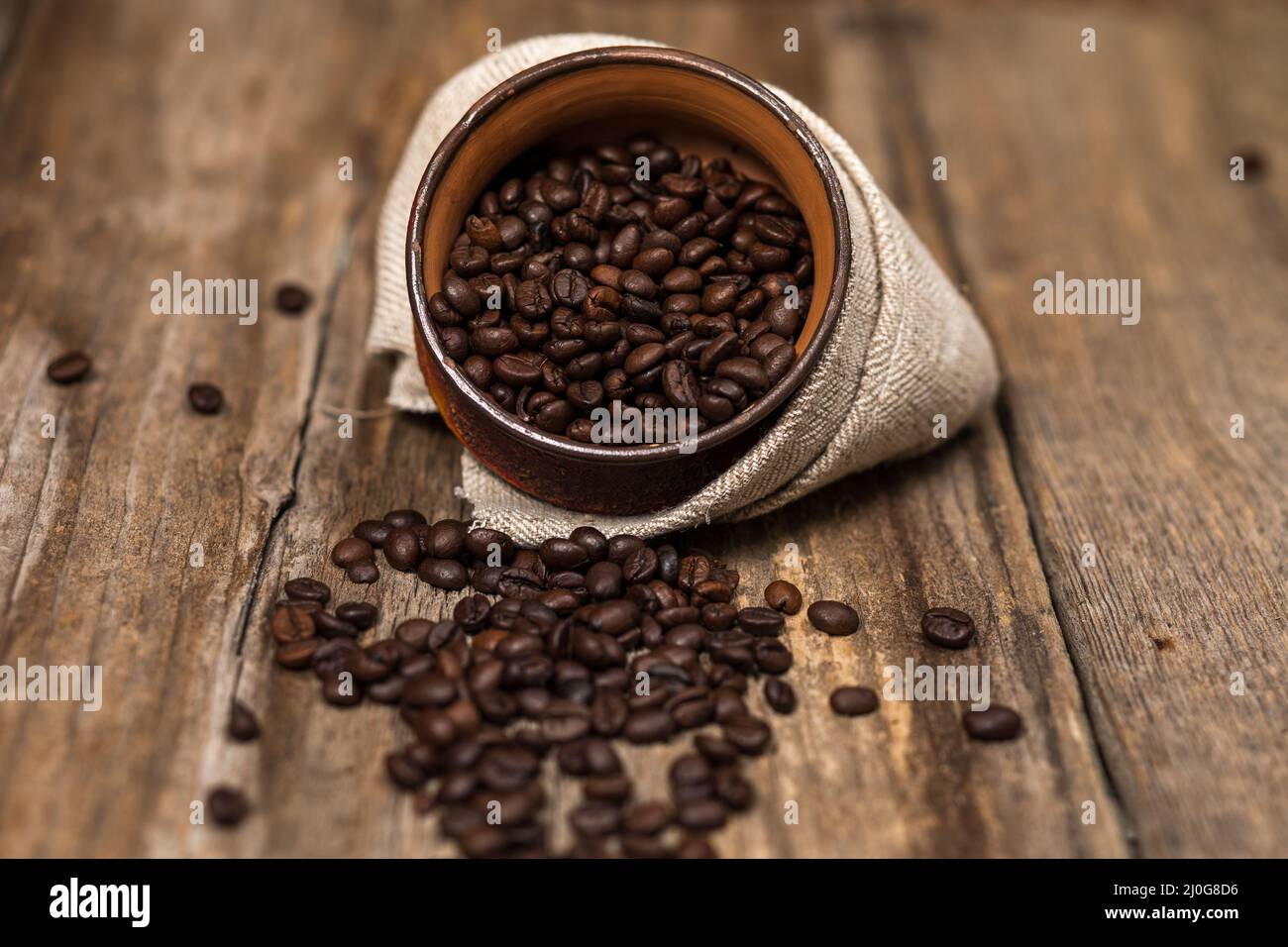 Coffee and coffee beans on old rustic wood table Stock Photo - Alamy