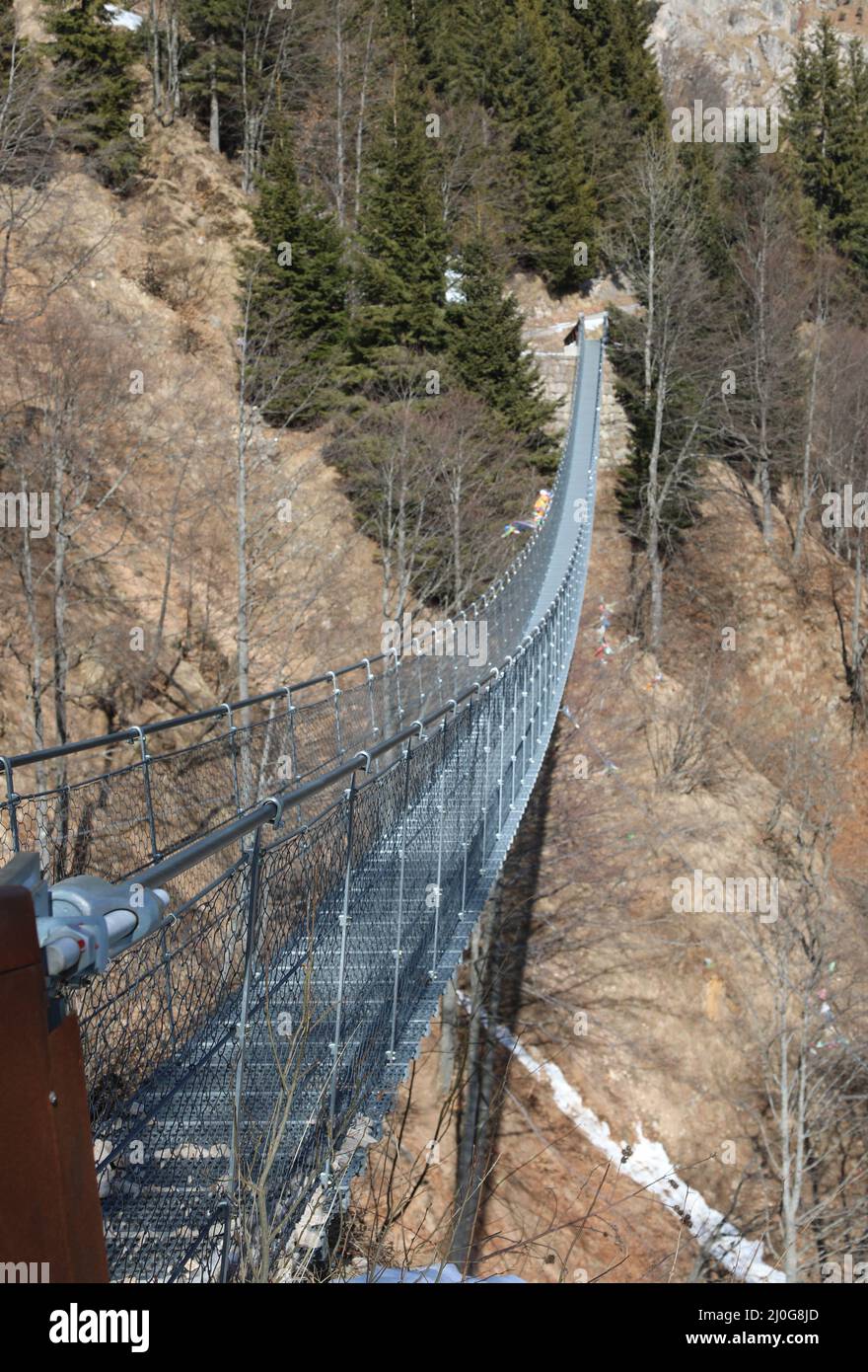 suspension bridge in stainless steel without people winter in Italy in Veneto Region Stock Photo