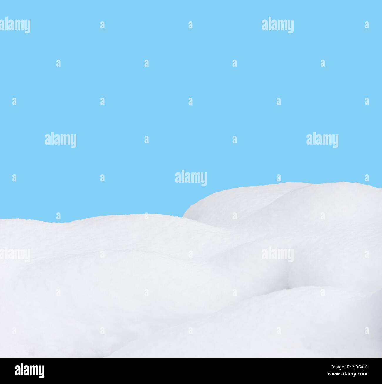Snow drifts isolated on bue background Stock Photo